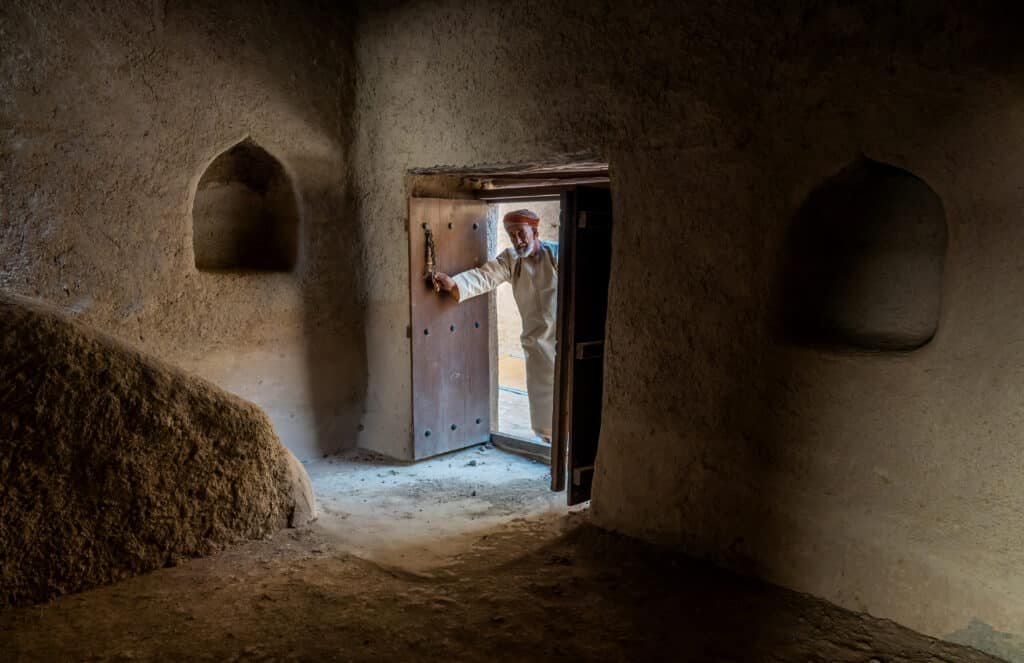 Architectural doorway framed by earthen walls